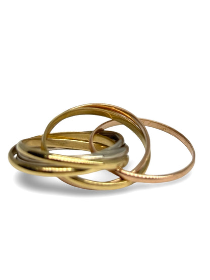 Bague Cartier Trinity Semainier en or 18 carats composée de plusieurs anneaux entrelacés au design iconique. Ce bijou de luxe allie élégance, symbolisme et savoir-faire joaillier. Appréciée pour ses lignes intemporelles et son style raffiné, cette bague Trinity Semainier constitue une pièce emblématique de la maison Cartier.