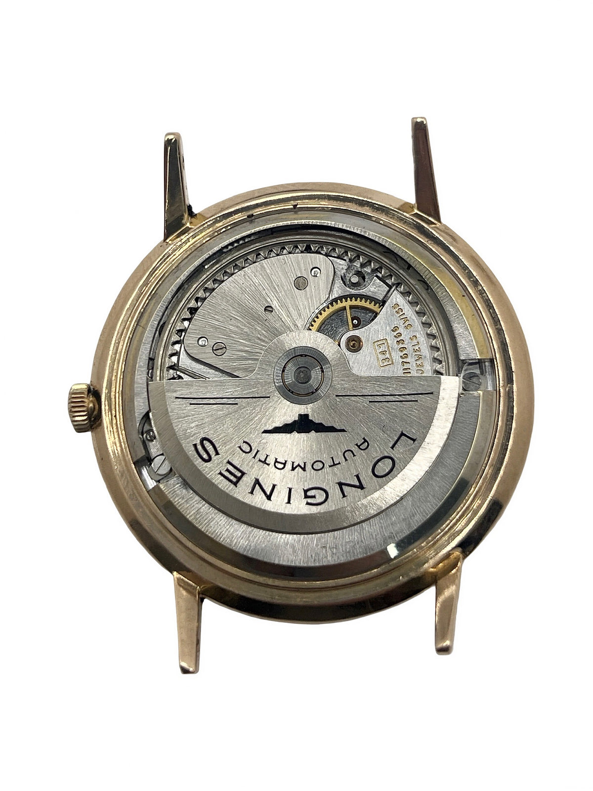 Montre Longines Flagship 2407 vintage en très bon état, datant approximativement de 1962, avec mouvement automatique calibre 341. Son boîtier de 35 mm en or rose est associé à un cadran argent à index bâtons et un verre Plexiglas. Cette Longines Flagship possède un bracelet en cuir de lézard brun avec boucle ardillon en acier. Elle dispose également d’une fonction date et d’un design élégant et intemporel.