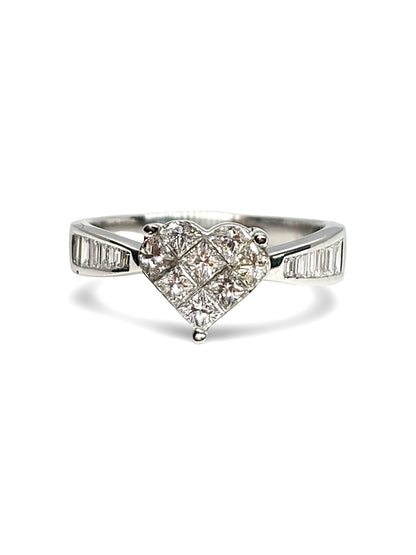 Solitaire cœur en or blanc 18 carats sublimé par un sertissage de diamants totalisant 0,79 carat. Cette bague élégante et romantique associe l’éclat de l’or blanc à la brillance des diamants pour un rendu raffiné. Un bijou intemporel, idéal pour célébrer un engagement, un anniversaire ou une occasion spéciale.